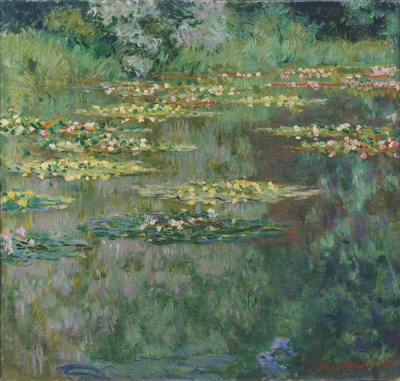 Bands of lily pads and reflected greenery spread across the surface of the garden pond.