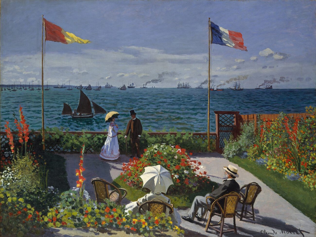 Figures gather on a flower-filled terrace overlooking the sea, framed by tall flagpoles and passing boats.